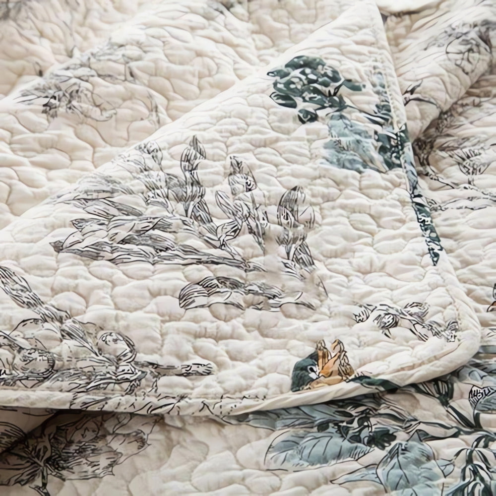 Queen and King floral cotton coverlet set on bed
