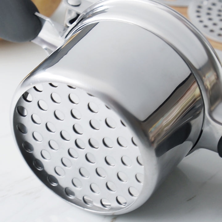 Close-up of the stainless steel perforated ricing disc