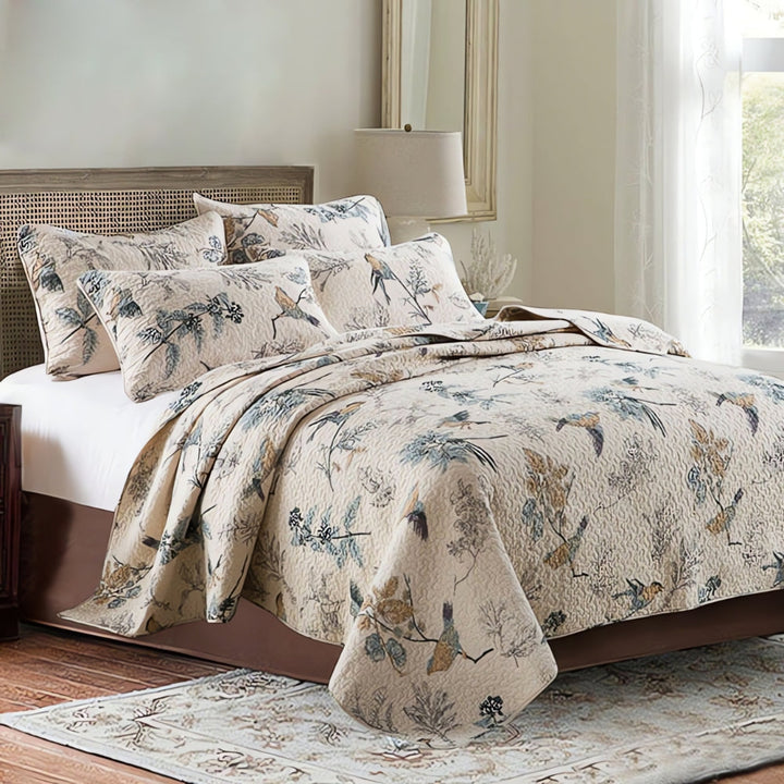 Floral cotton quilted coverlet set styled on a made bed