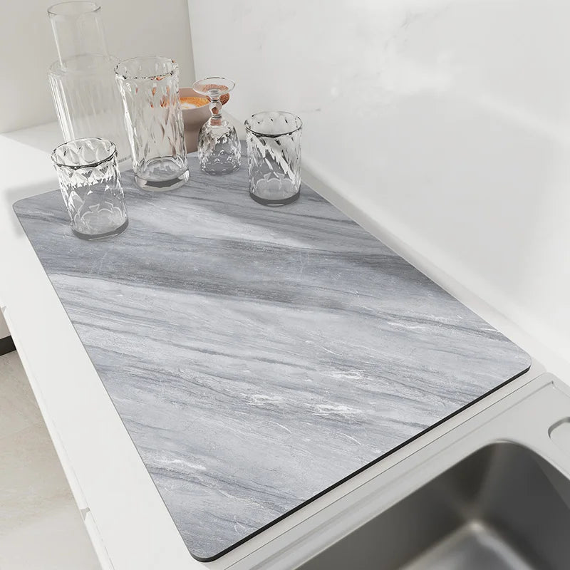 Slate gray marble diatomaceous earth drying mat on a kitchen counter