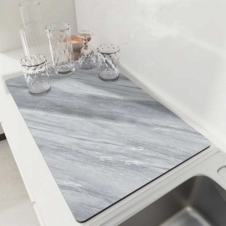 Slate gray marble diatomaceous earth drying mat on a kitchen counter