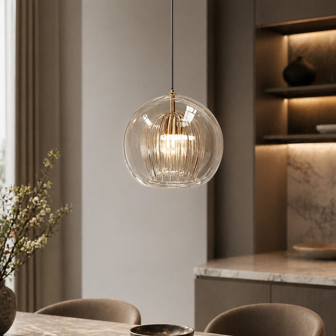 Modern clear glass pendant light over kitchen island