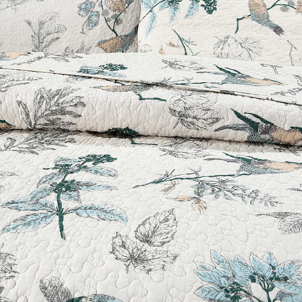 Cotton quilted coverlet with matching pillow shams