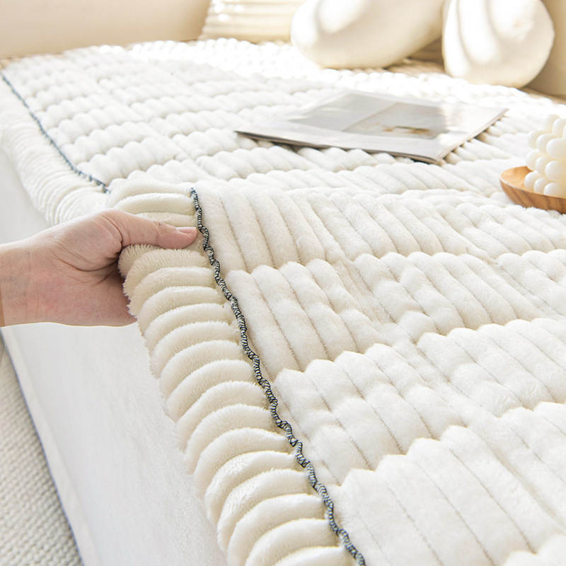Non-slip corduroy couch cover protecting a sofa seat from pets