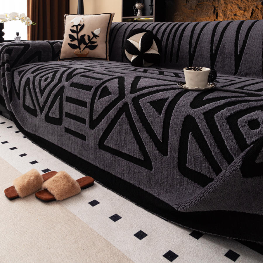 Boho sofa cover protecting a couch in a cosy living room