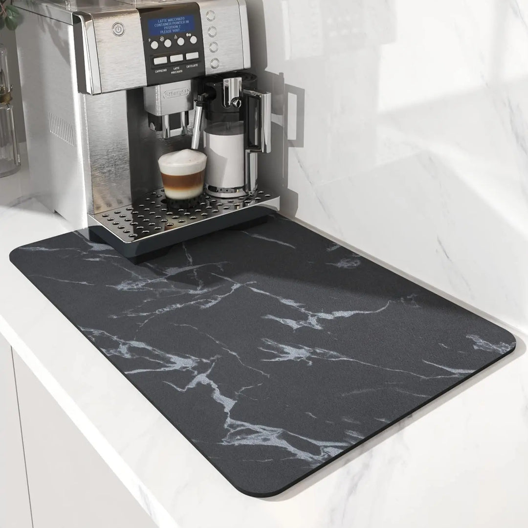 Dark gray marble coffee mat under a coffee machine