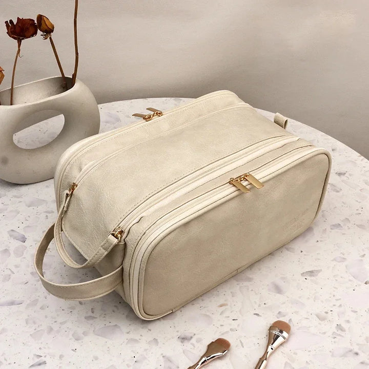 Beige PU faux leather travel makeup bag with zippered compartments