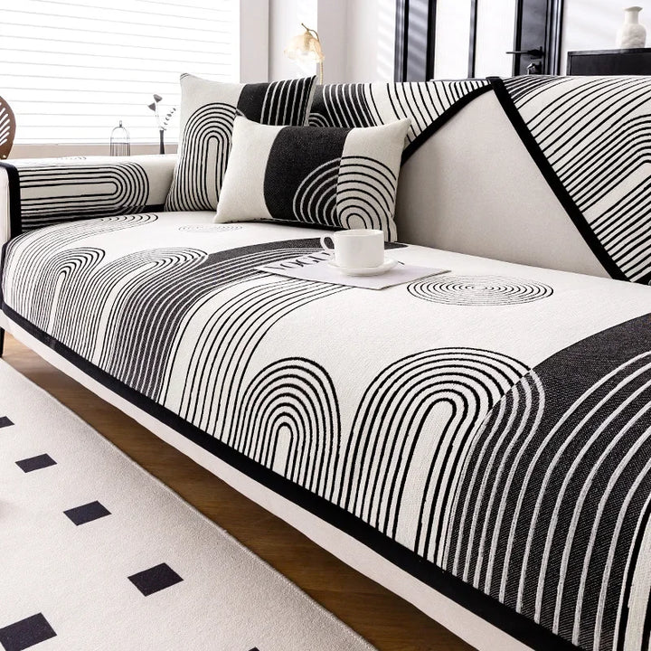 Black geometric stripe non-slip sofa cover on a couch