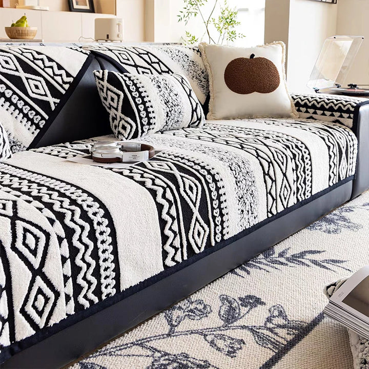 Black plush non-slip sofa cover on a living room couch