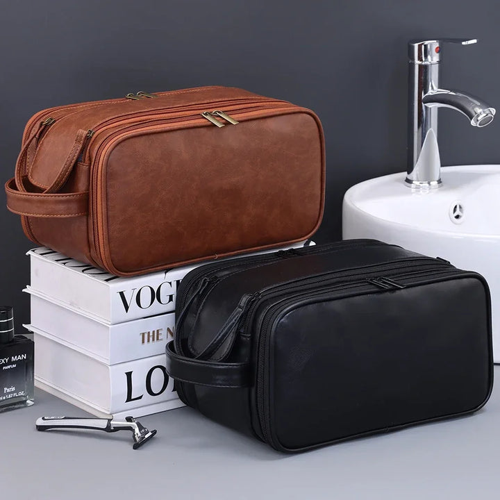 Brown and black PU faux leather toiletry bags beside a sink
