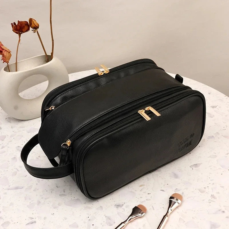 Black PU faux leather travel makeup bag with zippered compartments