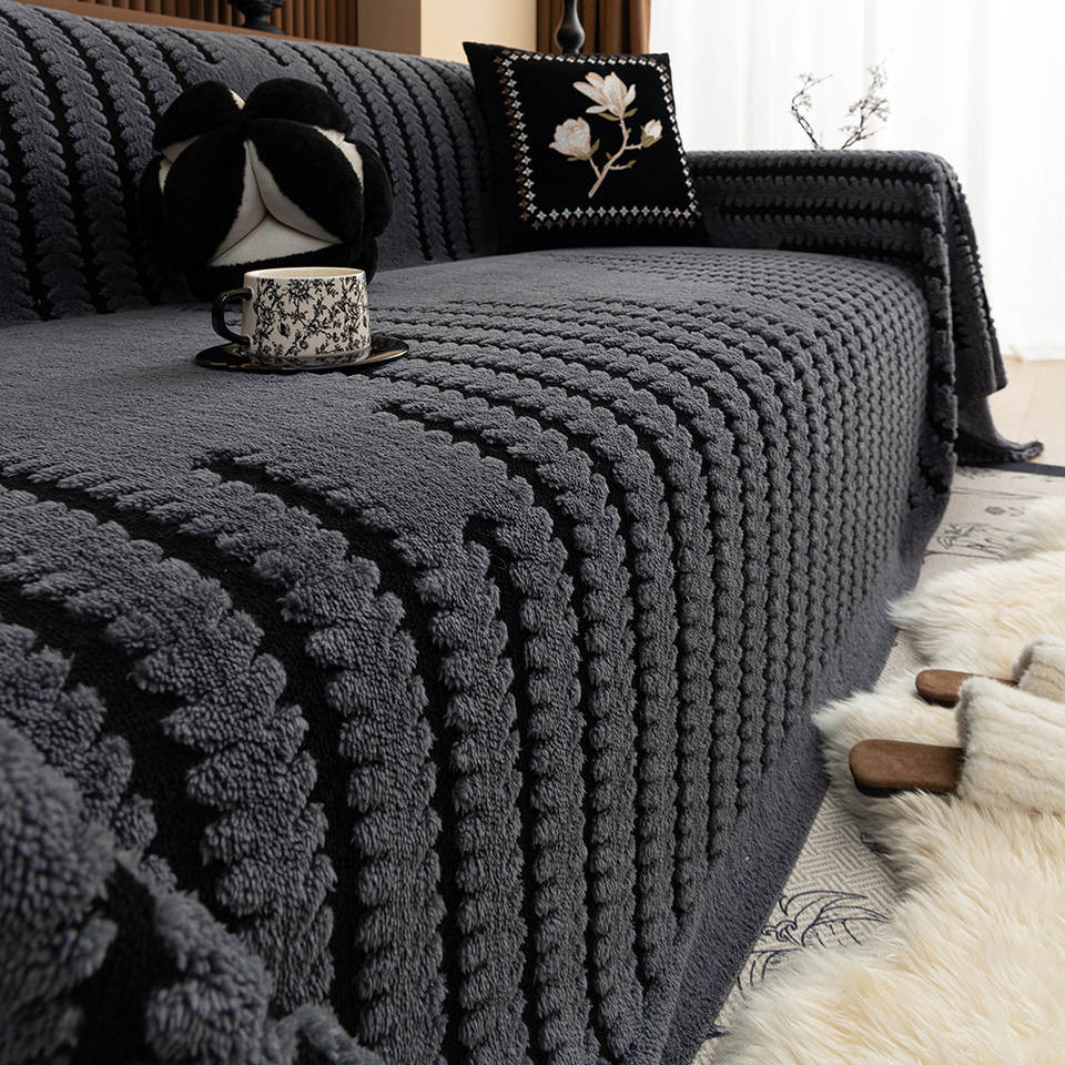 Warm winter plush sofa cover styled in a cosy living room