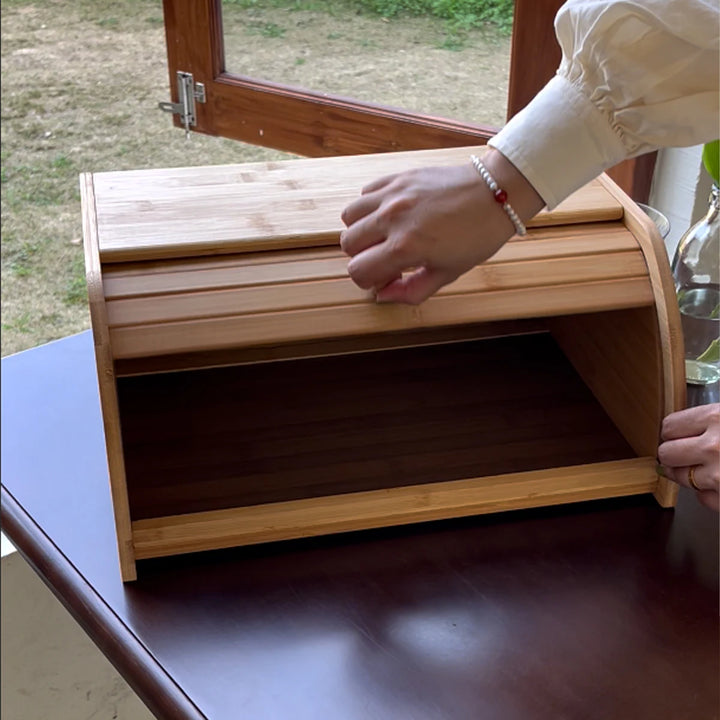 Bamboo wooden bread box on kitchen countertop