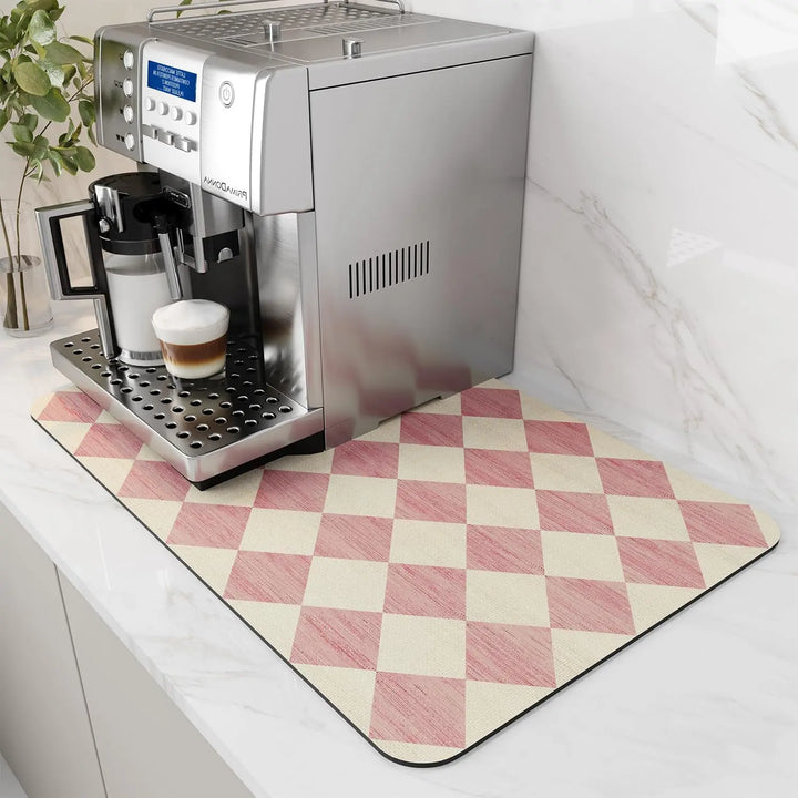 Pink checker coffee mat under a coffee machine