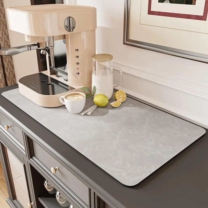 Coffee mat under a coffee machine on a kitchen console
