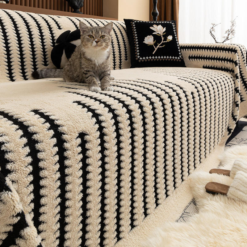 Plush tufted sofa cover in white on a three-seater couch