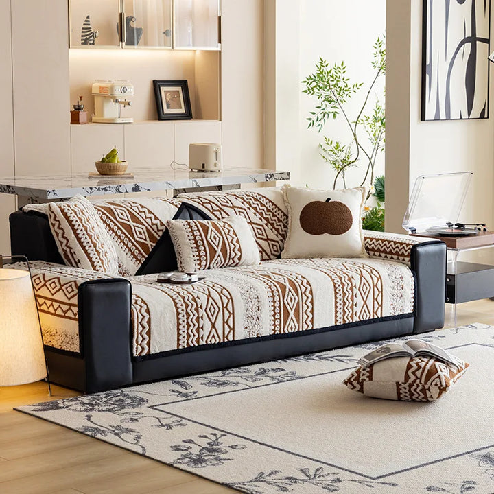 Plush sofa cover draped over a corner couch