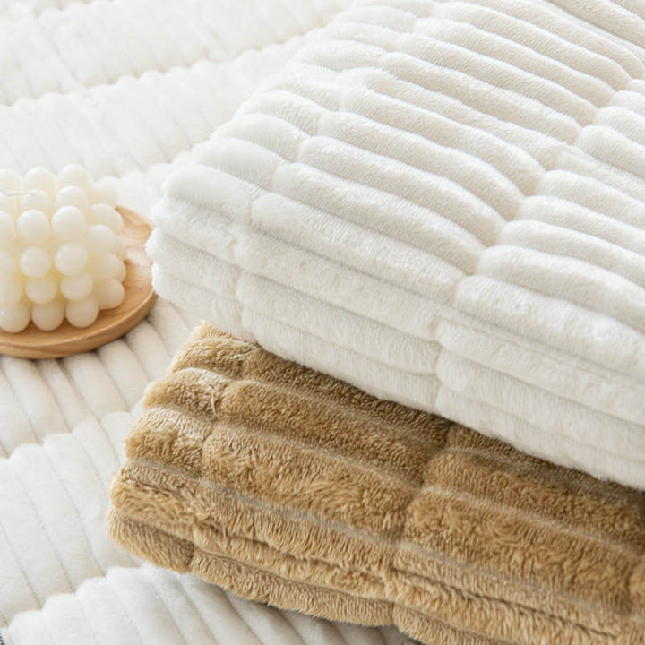 Machine washable corduroy couch cover styled on a loveseat