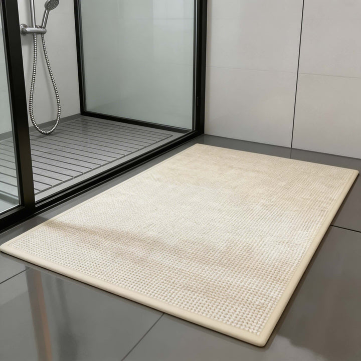 Non-slip absorbent braided bath mat in modern bathroom